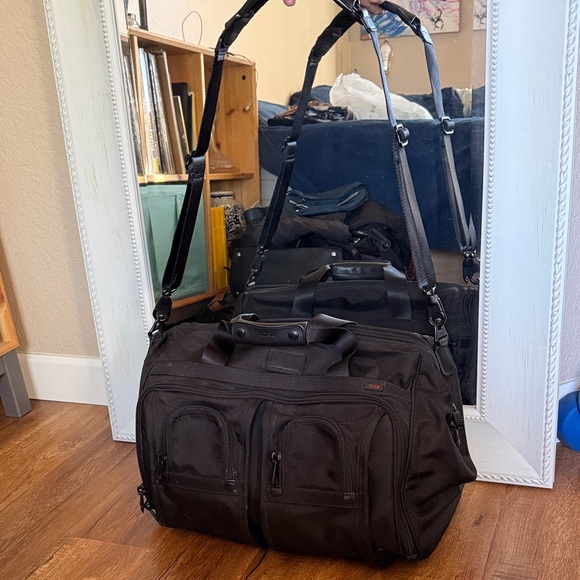Tumi black travel bag/carryon